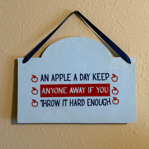 An Apple a Day Keeps Anyone Away If You Throw It Hard Enough Sign