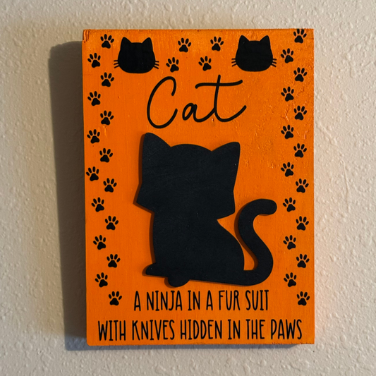 Cat: A Ninja In A Fur Suit With Knives Hidden In The Paws Sign