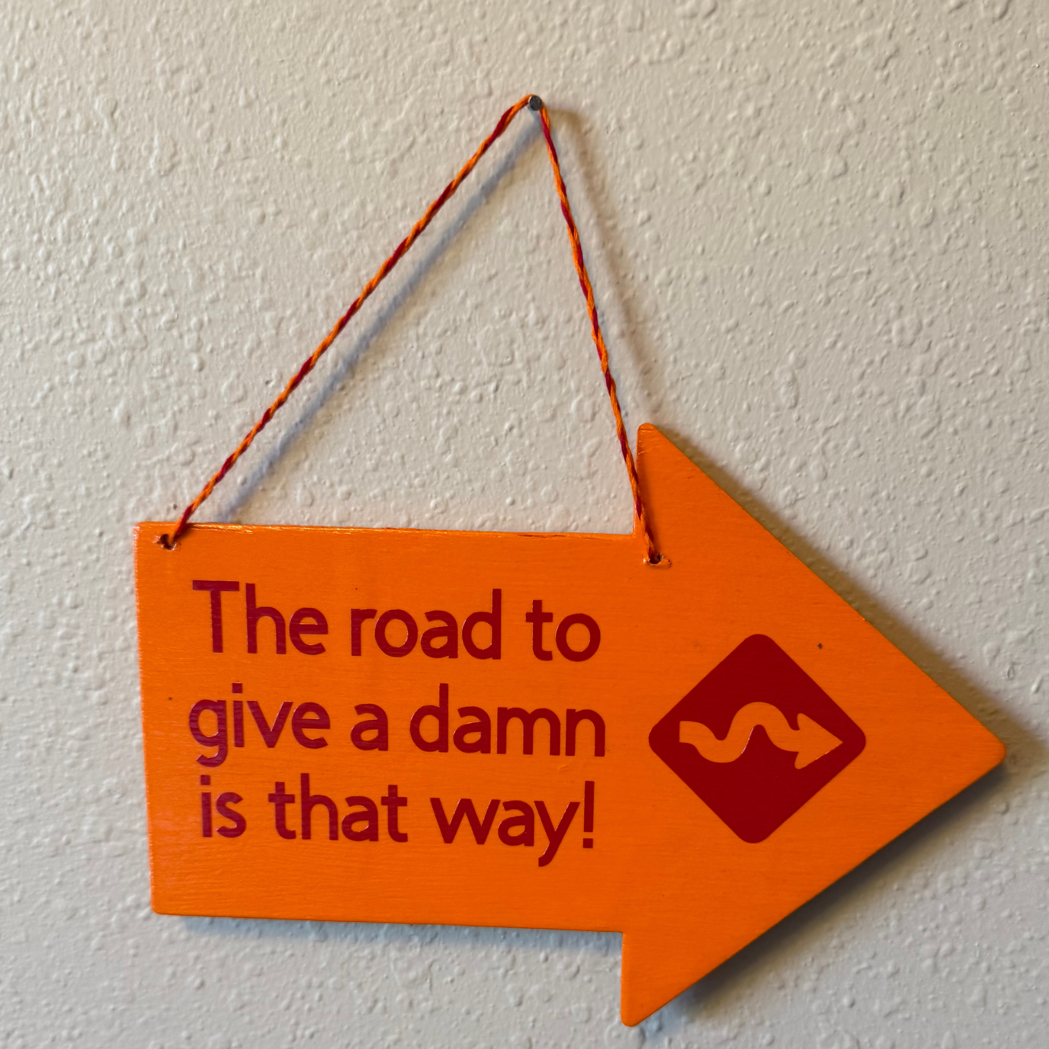 The Road To Give A Damn Is That Way Sign