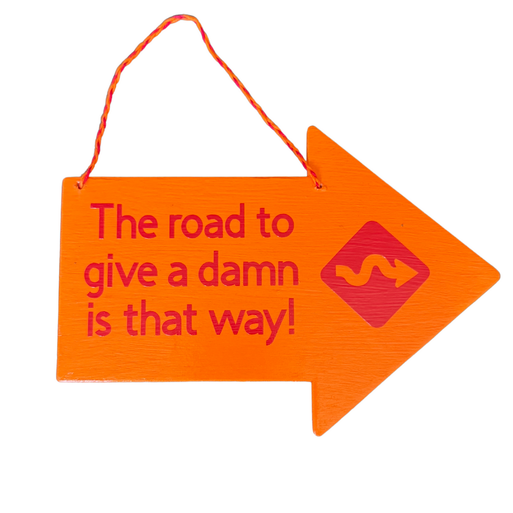 The Road To Give A Damn Is That Way Sign